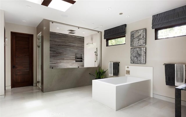 bathroom with separate shower and tub