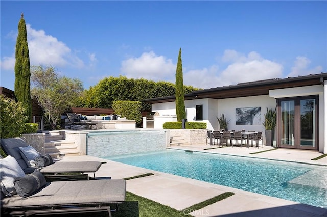 view of swimming pool with a patio area