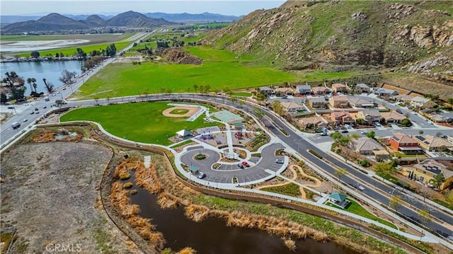 bird's eye view with a water and mountain view