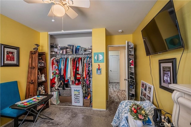 bedroom with carpet, a ceiling fan, and a closet