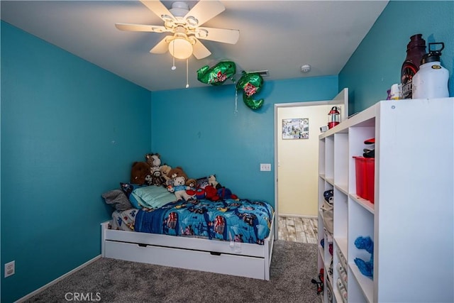 unfurnished bedroom featuring ceiling fan, carpet, and visible vents