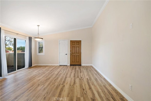 unfurnished room with crown molding and light hardwood / wood-style floors