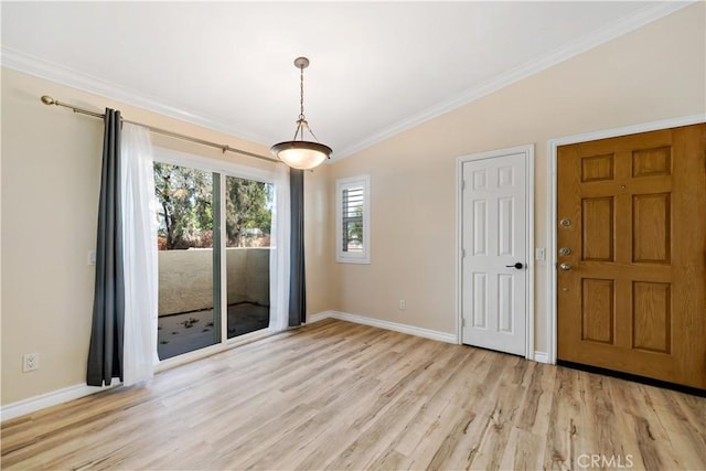 interior space featuring crown molding and light wood-type flooring