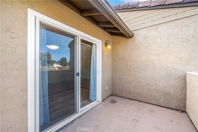 entrance to property featuring a patio area