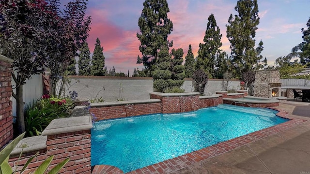 41 Baroness Ln, Laguna Niguel, CA 92677 - pool at dusk with a fenced backyard, an in ground hot tub, a patio, and a fenced in pool