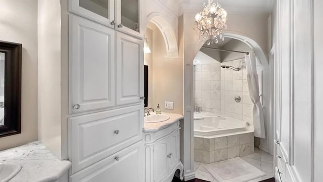 41 Baroness Ln, Laguna Niguel, CA 92677 - bathroom featuring vanity, tiled shower / bath combo, and a chandelier
