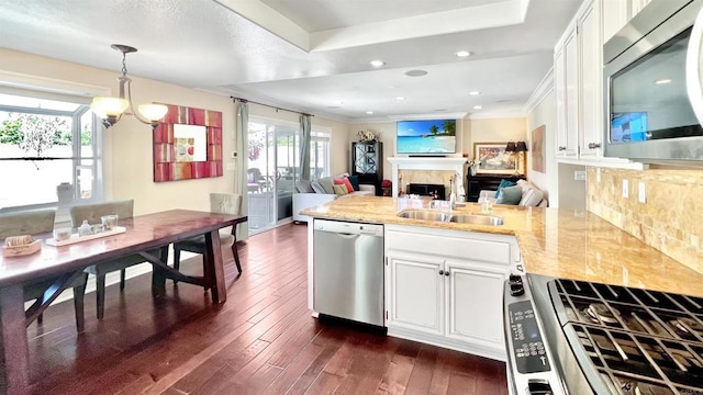 41 Baroness Ln, Laguna Niguel, CA 92677 - kitchen with plenty of natural light, a peninsula, appliances with stainless steel finishes, and a sink