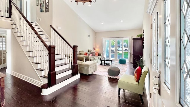 41 Baroness Ln, Laguna Niguel, CA 92677 - stairway featuring wood finished floors, high vaulted ceiling, visible vents, baseboards, and recessed lighting