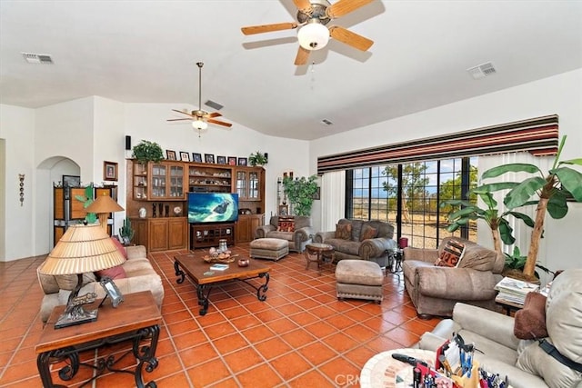 tiled living room featuring vaulted ceiling and ceiling fan