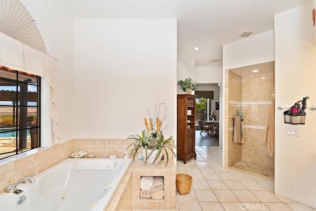 bathroom with plus walk in shower and tile patterned floors