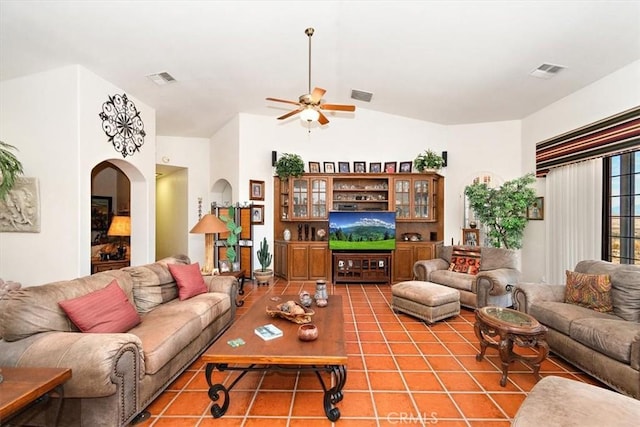 tiled living room with vaulted ceiling and ceiling fan