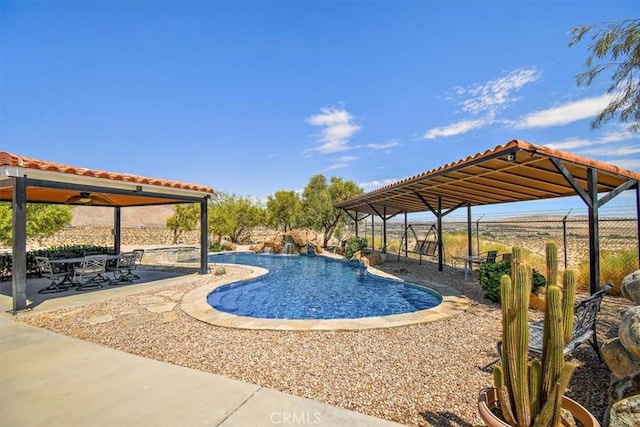 view of swimming pool featuring a patio and pool water feature