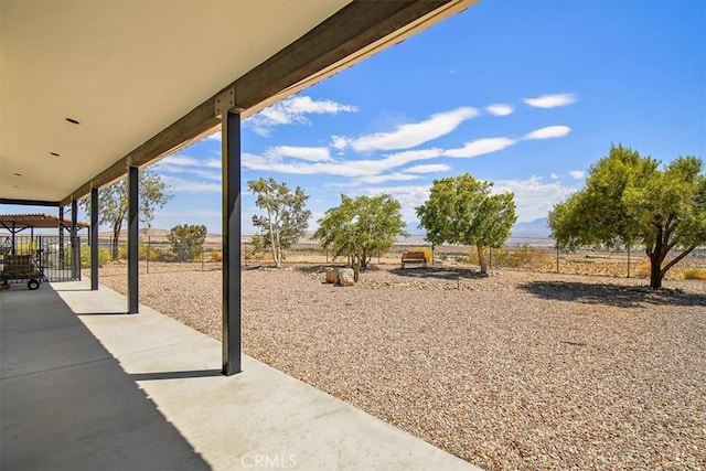 view of yard with a patio and a rural view