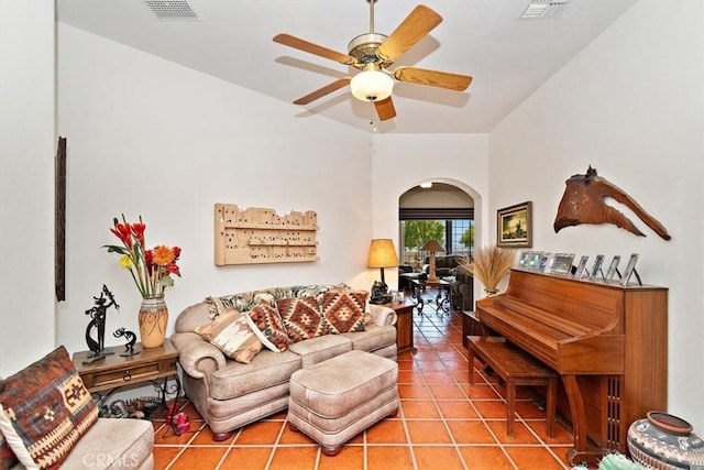 living room with ceiling fan and tile patterned floors