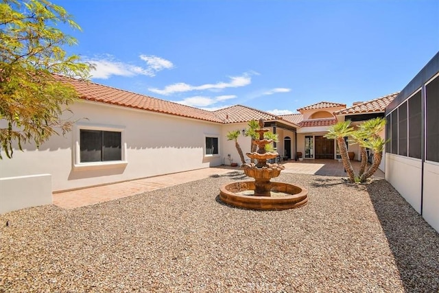 rear view of house featuring a patio area