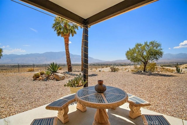 view of patio featuring a mountain view and a rural view