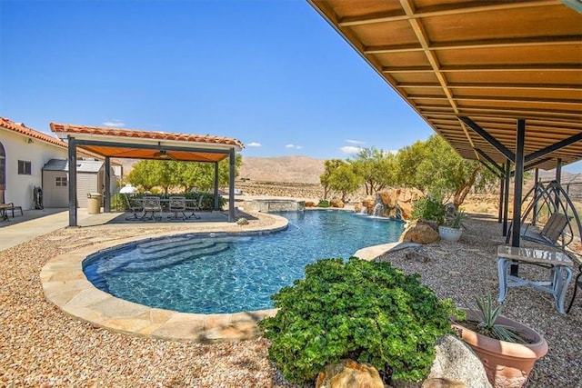 view of swimming pool with a patio area and pool water feature