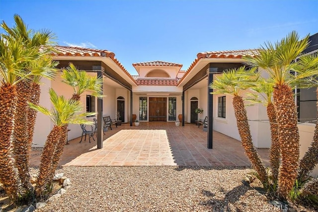 rear view of property featuring a patio