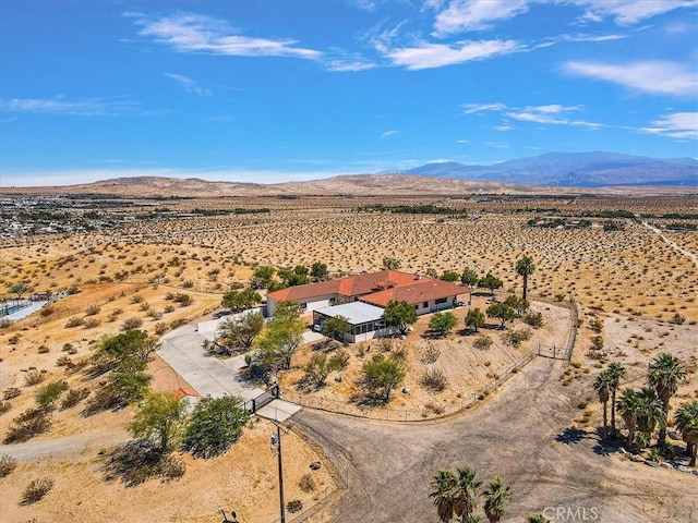 birds eye view of property featuring a mountain view