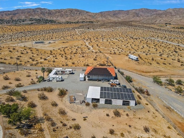 birds eye view of property with a mountain view