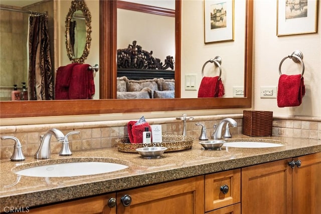 bathroom with tasteful backsplash, vanity, and walk in shower