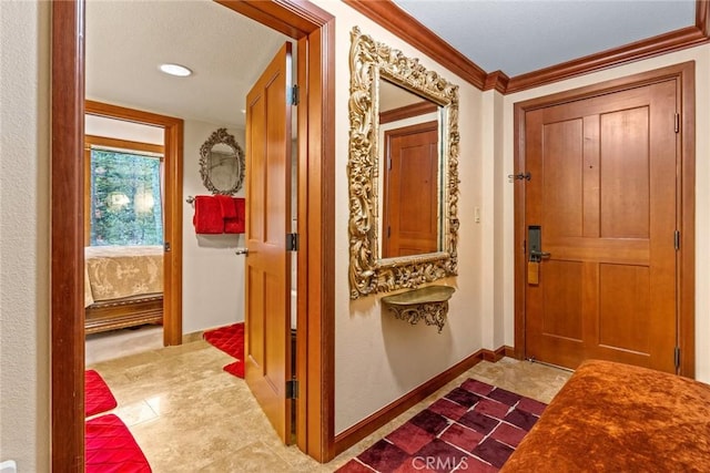 foyer entrance featuring ornamental molding