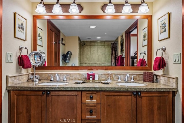 bathroom with vanity, a shower with shower curtain, and decorative backsplash