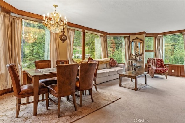 dining space with light colored carpet and a chandelier