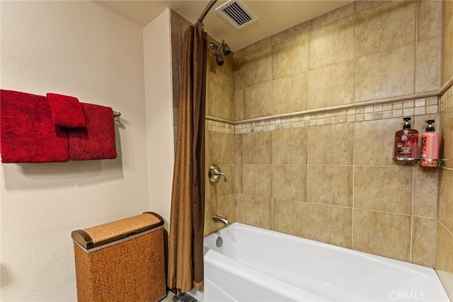 bathroom with shower / bath combination with curtain