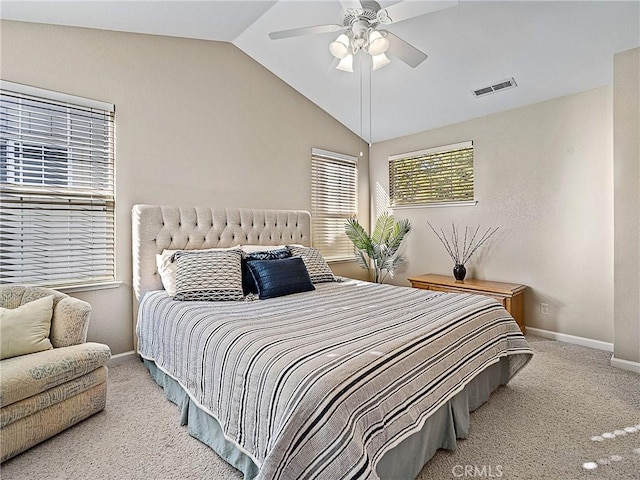 bedroom featuring visible vents, baseboards, lofted ceiling, and carpet floors