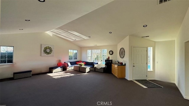 living room with lofted ceiling, carpet flooring, baseboards, and visible vents