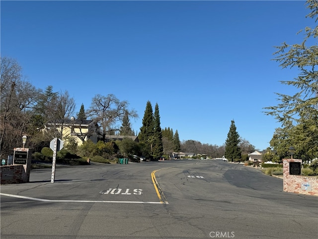 view of street featuring traffic signs and street lights