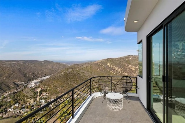 balcony featuring a mountain view