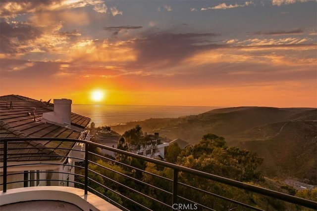 balcony at dusk with a water view