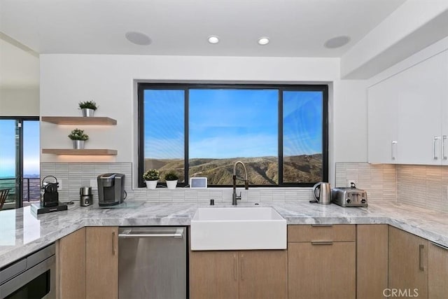 kitchen featuring open shelves, appliances with stainless steel finishes, a sink, recessed lighting, and backsplash