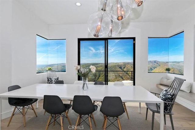 dining room with baseboards, recessed lighting, and a notable chandelier