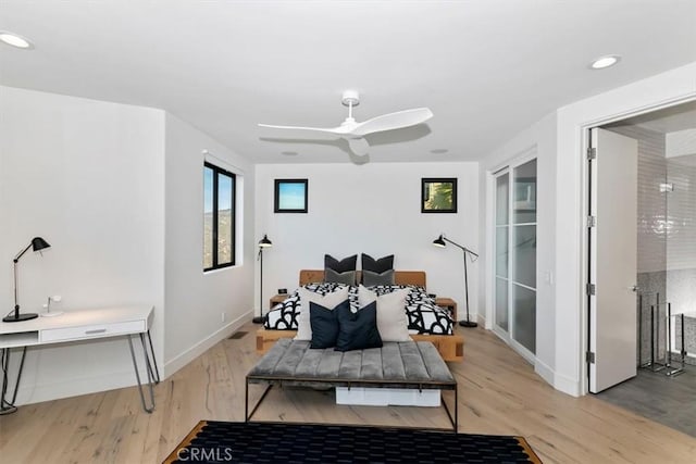 bedroom with baseboards, recessed lighting, light wood-style flooring, and ceiling fan