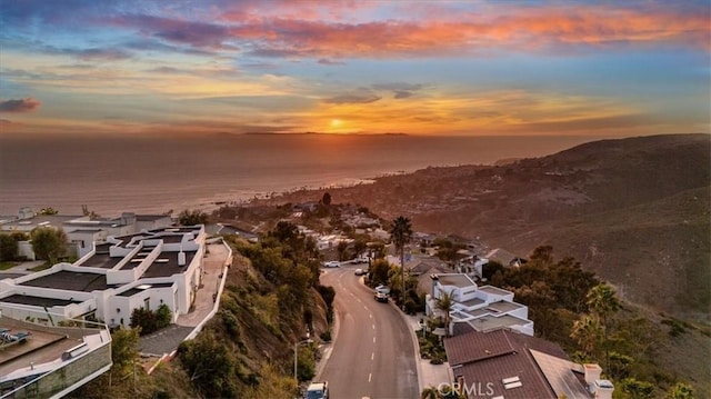 aerial view at dusk with a residential view and a mountain view