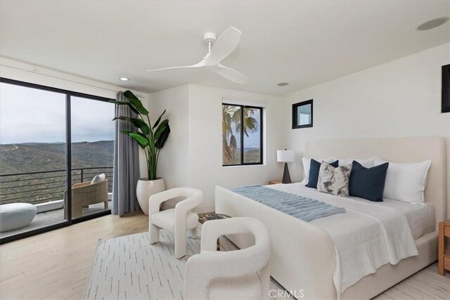 1425 Skyline Dr, Laguna Beach, CA 92651 - bedroom with multiple windows, access to exterior, light wood finished floors, expansive windows, and recessed lighting