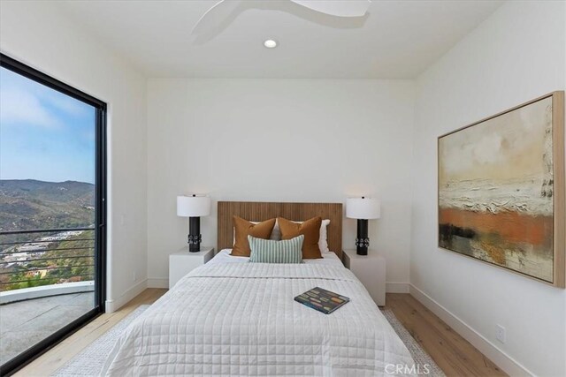 1425 Skyline Dr, Laguna Beach, CA 92651 - bedroom with wood finished floors, a ceiling fan, and a mountain view