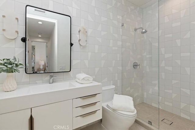 1425 Skyline Dr, Laguna Beach, CA 92651 - bathroom featuring tiled shower, vanity, and tile walls