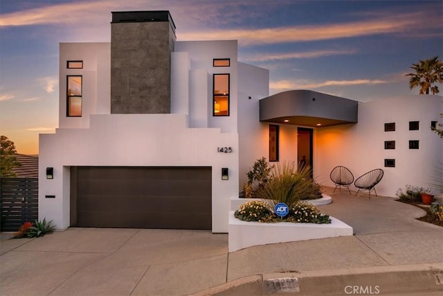 1425 Skyline Dr, Laguna Beach, CA 92651 - contemporary house with a garage, concrete driveway, and stucco siding