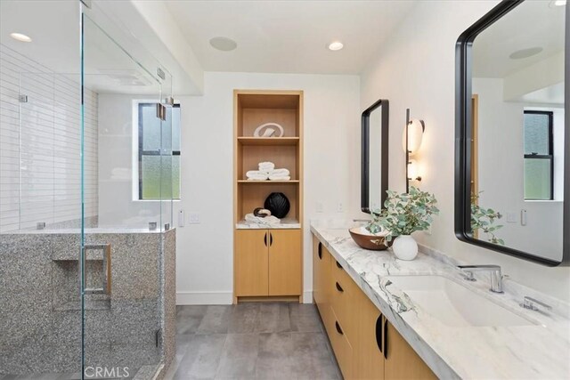 1425 Skyline Dr, Laguna Beach, CA 92651 - full bathroom featuring double vanity, a stall shower, built in shelves, and recessed lighting