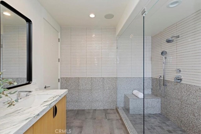 1425 Skyline Dr, Laguna Beach, CA 92651 - full bath with vanity, a tile shower, recessed lighting, and wood finished floors
