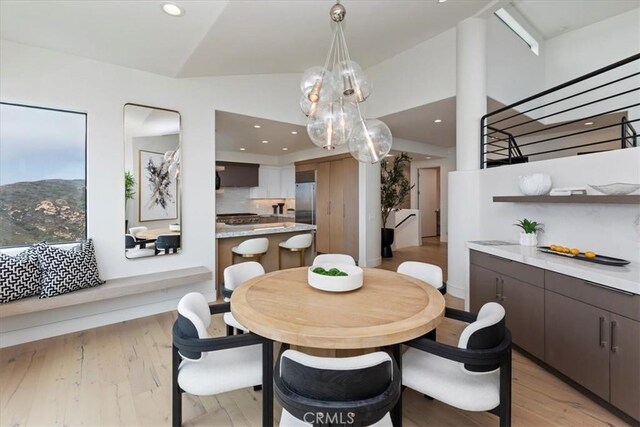 1425 Skyline Dr, Laguna Beach, CA 92651 - dining space with lofted ceiling, light wood-style floors, recessed lighting, and stairs