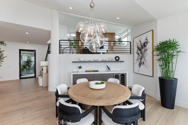 1425 Skyline Dr, Laguna Beach, CA 92651 - dining space with a chandelier, light wood-style floors, wine cooler, healthy amount of natural light, and recessed lighting