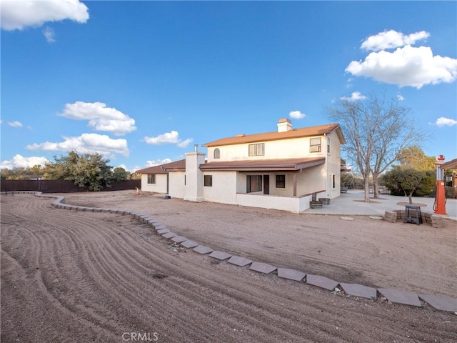 back of house featuring a patio