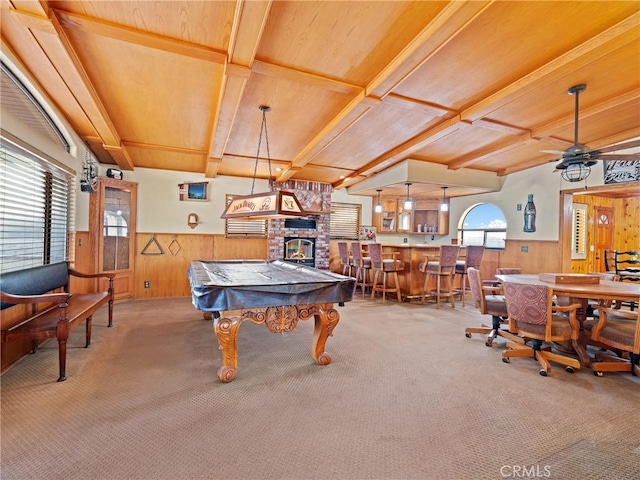 rec room with beamed ceiling, pool table, bar area, and carpet flooring