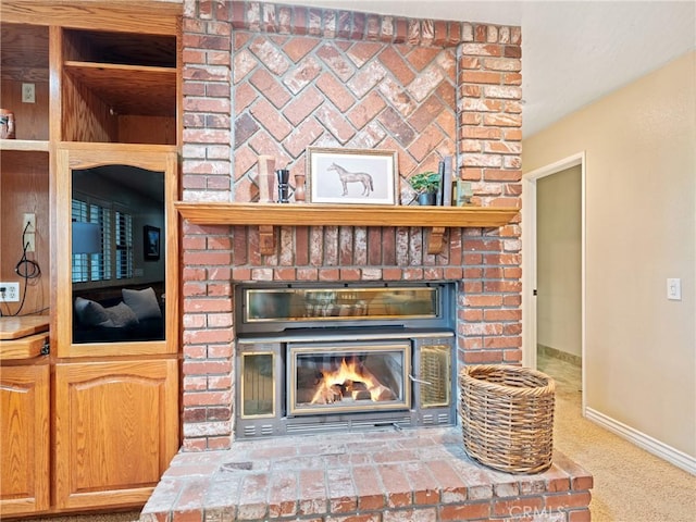 details featuring a brick fireplace and carpet flooring