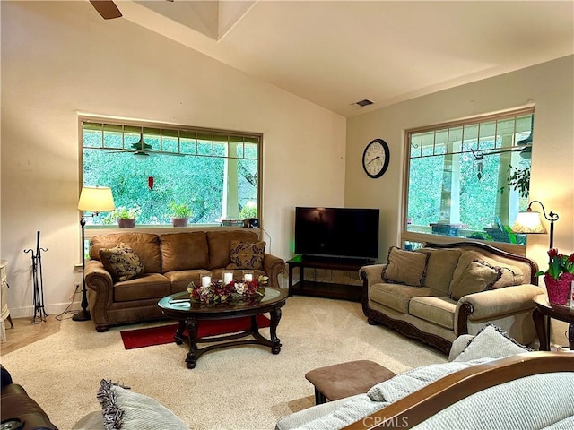 living room featuring vaulted ceiling and light colored carpet